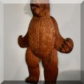 D13. Moving bear carving wall hanging. 